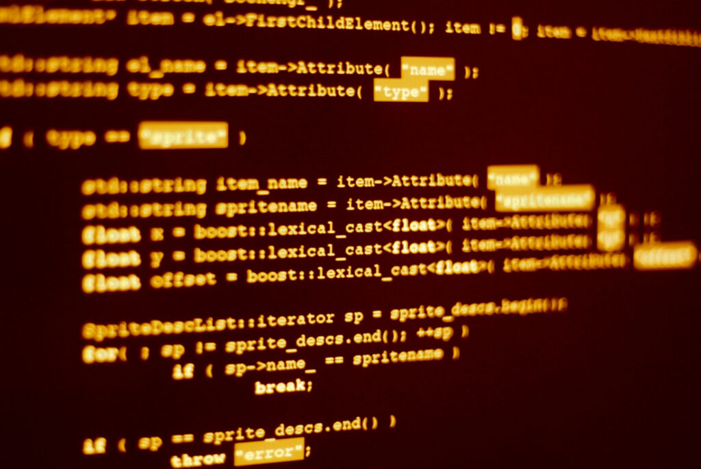 Close-up de um código de computador com a frase 'que é um cookie de internet' destacada em uma tela de notebook.